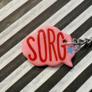 Sorg pink taleboble nøglering